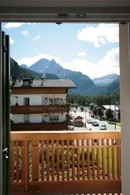 a view of the mountains from the balcony of a hotel at Garni Eden in Canazei