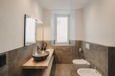 a bathroom with a bowl sink and a toilet at Stein unter Lebenberg NEW 2026 in Cermes