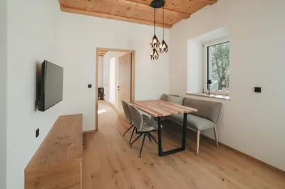 a dining room with a table and chairs at Stein unter Lebenberg NEW 2026 in Cermes