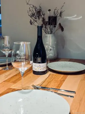 a bottle of wine sitting on a table with glasses at Stein unter Lebenberg NEW 2026 in Cermes