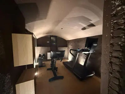 an overhead view of a room with a gym at La Maison 35 - Zentrales Wohnhaus in Bruneck in Brunico