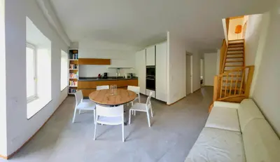 a kitchen and dining room with a table and chairs at Casa Diletta in Prade