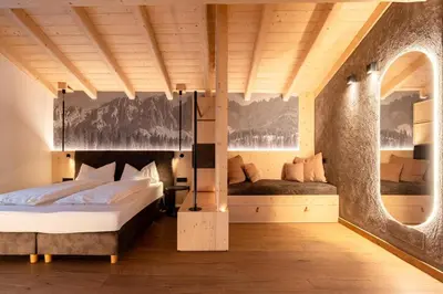 a bedroom with two beds in a room at Guest House Fleim in Panchia