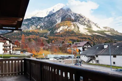 a balcony with a view of a snowy mountain at Comodo appartamento a San Vito di Cadore in San Vito di Cadore