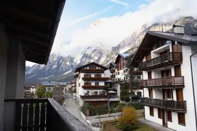a view from the balcony of a hotel in the mountains at Appartamento panoramico al 2 Piano in San Vito di Cadore