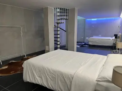a bedroom with a large white bed in a room at App stay in Bolzano