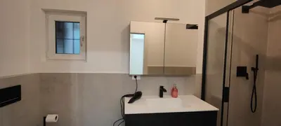 a bathroom with a white toilet and a bidet at App stay in Bolzano
