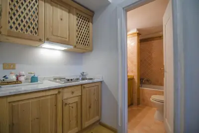 a bathroom with a sink and a toilet at Monolocale romantico tra le vette di Cortina in Cortina dʼAmpezzo