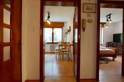 a view of a living room and a dining room at Casa vacanze Danoi Dolomiti in Canale dʼAgordo