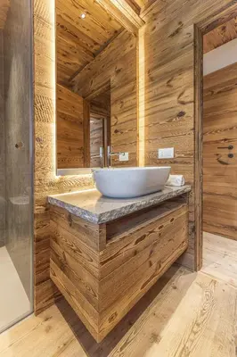 a bathroom with a sink and a mirror at Casa Poligrafica 1 in Cortina dʼAmpezzo