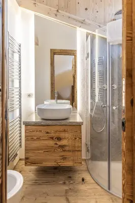 a bathroom with a sink and a shower at Casa Poligrafica 1 in Cortina dʼAmpezzo