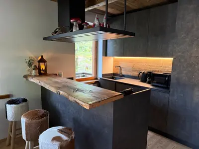 a kitchen with a counter top and a sink at SciaLet in Campitello di Fassa