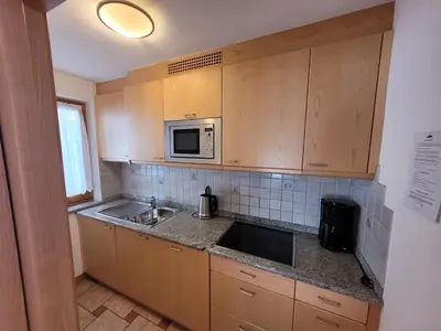 a kitchen with a sink and a microwave at Chalet Milandora in La Villa