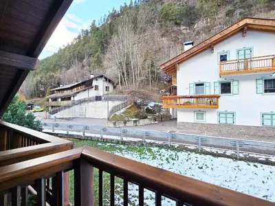 a view from the balcony of a house at Attico Lagorai - Alpine Stay Apartments in Ziano di Fiemme