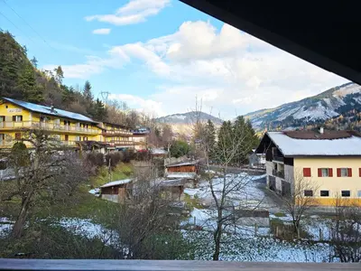a kitchen with a table with a table cloth on it at Attico Lagorai - Alpine Stay Apartments in Ziano di Fiemme