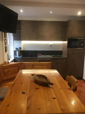 a wooden table with a bowl on top of it in a kitchen at Appartamento Casa Latemar in Predazzo