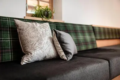 two pillows sitting on top of a couch at Großplonerhof in Luson