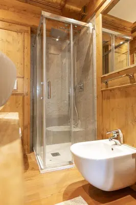 a bathroom with a shower and a white sink at Casa Maddalena, quiet and very comfortable in Cortina dʼAmpezzo