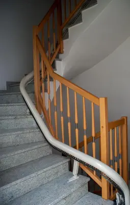 a set of stairs with a metal hand rail at Appartamento Agritur nel Verde in Brez
