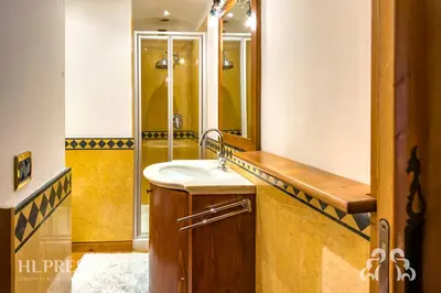 a bathroom with a sink and a shower at Suite Villa Francesca in Cortina dʼAmpezzo