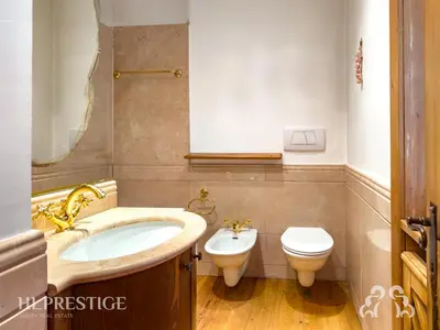 a bathroom with a sink and a toilet at Suite Villa Francesca in Cortina dʼAmpezzo