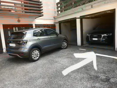 a car is parked in a parking garage at Cortina Relax in Cortina dʼAmpezzo