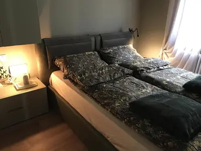 a bed with two pillows on it in a bedroom at Masiere - La Chicca in Masarè