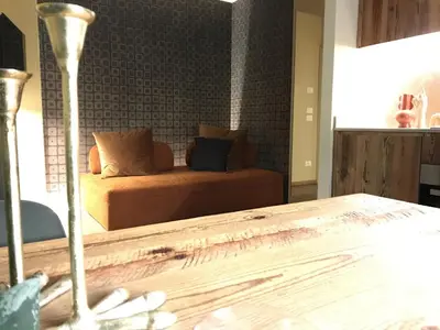 a living room with a couch and a wooden table at Masiere - La Chicca in Masarè