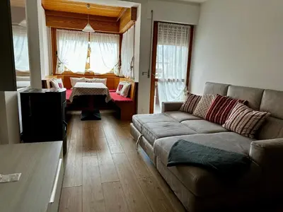 a living room with a couch and a table at Da Benny in Caprile