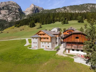 an aerial view of a house in the mountains at Ciasa Francësch in La Villa