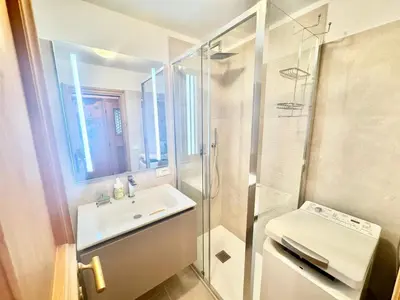 a bathroom with a sink and a shower and a toilet at Cozy Apartment - Alverà in Cortina dʼAmpezzo