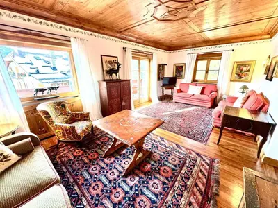 a living room with a couch and a table at Ca Montagni - High-end apartment Verocai in Cortina dʼAmpezzo