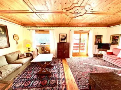 a living room with a couch and a table at Ca Montagni - High-end apartment Verocai in Cortina dʼAmpezzo