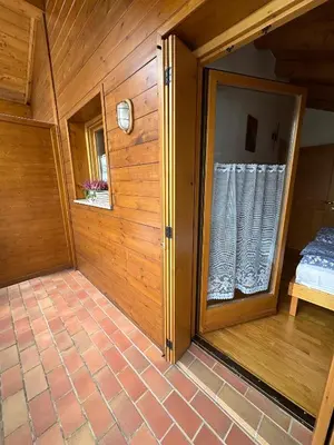 a small room with a window in a house at Appartamento Pelenzana in Predazzo