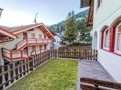 a courtyard in a house with a fence at Apartment Appartamento Ghezzi by Interhome in Campitello