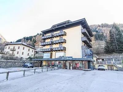 a large building on the side of a mountain at Apartment Nuccia Navalge by Interhome in Moena