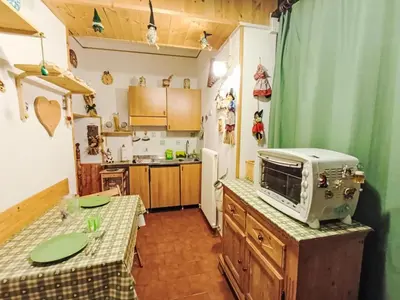 a kitchen with a microwave on top of a counter at Apartment Solaria-5 by Interhome in Mazzin