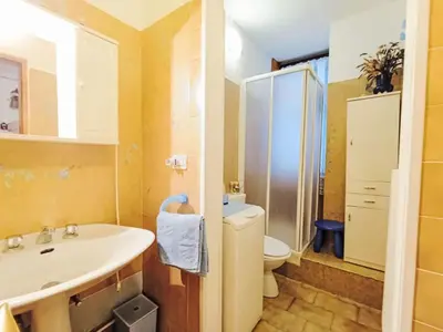 a bathroom with a sink and a mirror at Apartment Solaria-5 by Interhome in Mazzin
