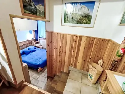 a kitchen with a table and a microwave at Apartment Solaria-5 by Interhome in Mazzin