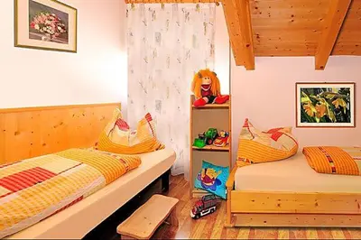 a bedroom with two twin beds in a room at Apartment Walder in Fiumes