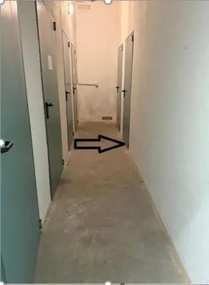 a corridor of a hallway with stalls in a building at Precumon 8'1 in Arabba
