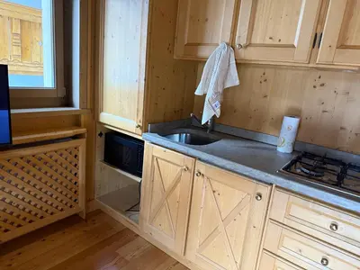 a kitchen with a sink and a counter top at Precumon 8'1 in Arabba