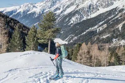 a person standing on top of a snow covered mountain at Aberle Hof in Rasùn di Sotto