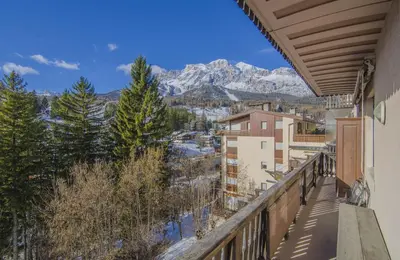 a balcony with a view of the mountains at La tua coccola a Cortina in Cortina dʼAmpezzo