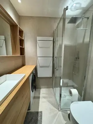 a bathroom with a shower and a toilet and a sink at Via Cantore Exclusive Stay in Cortina dʼAmpezzo