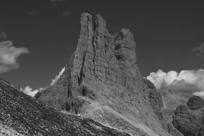 a large rock formation on top of a mountain at Appartamento Ciamp in Pozza di Fassa