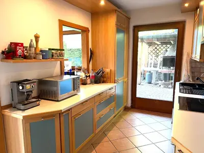 a kitchen with a counter with a microwave on it at Villa Grumes by Sunhome Fiemme in Grumes