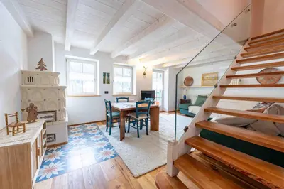 a room with a staircase and a dining room at Cesa Cres in Pera