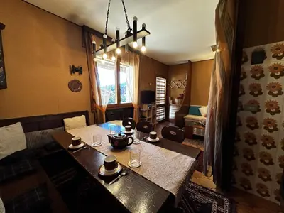 a dining room with a table with cups on it at Cortina Chalet Skyview in Zuel