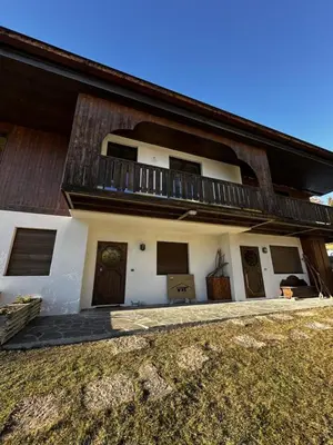 a house with a balcony on the side of it at Cortina Chalet Skyview in Zuel